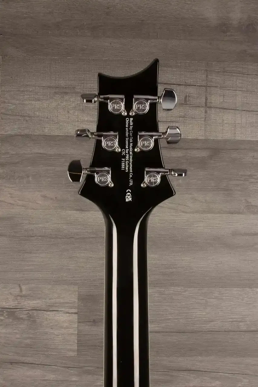 Close-up view of the PRS SE Hollowbody Standard guitar headstock with tuning pegs.