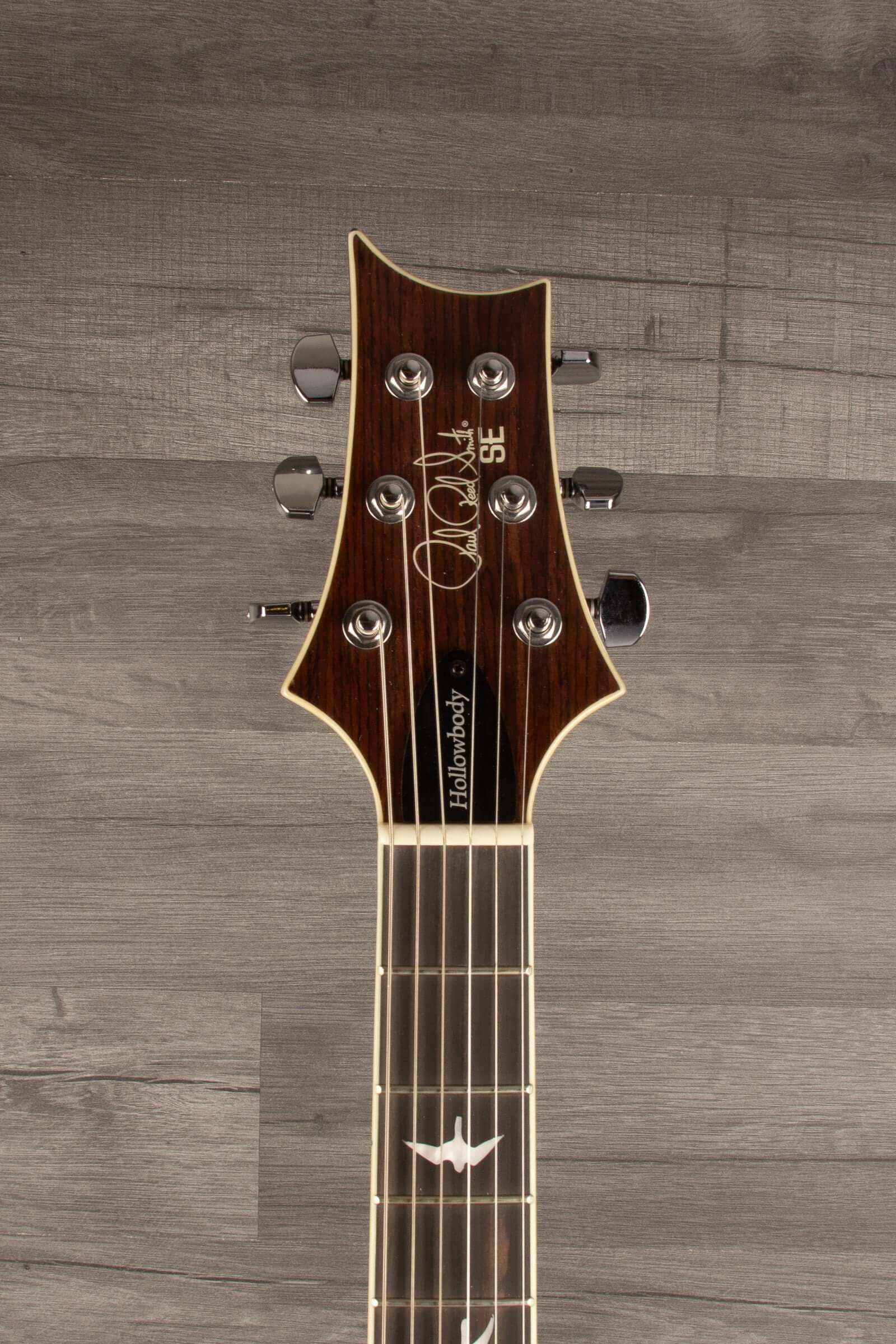 Used PRS SE Hollowbody Standard Fire Red Burst guitar headstock with inlays and tuning pegs.