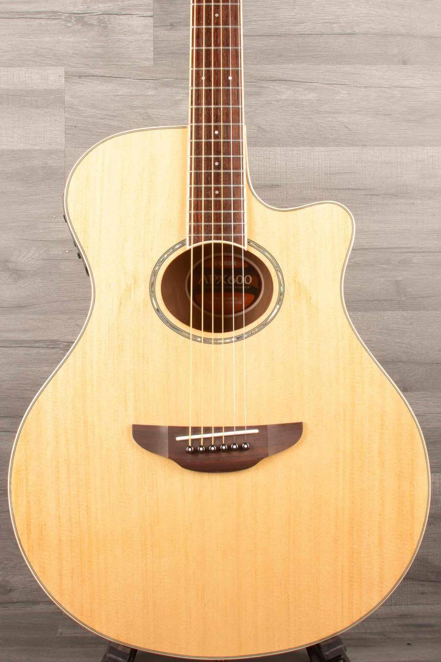 USED - Yamaha APX600 Electro Acoustic Guitar - Natural with cutaway, thin body, and inlaid soundhole rosette.
