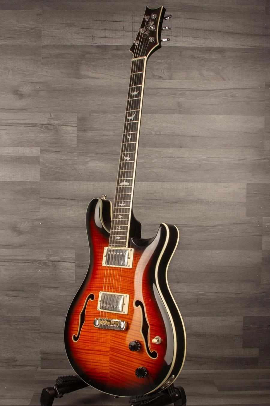 USED PRS SE Hollowbody II Electric Guitar - Tricolour Sunburst on display, showcasing flamed maple top and hollow construction.
