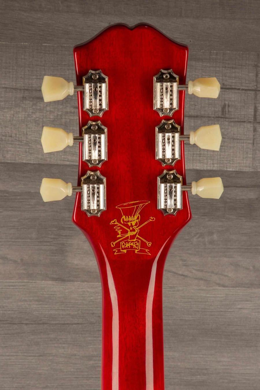 Close-up of the headstock of a USED Epiphone Les Paul Slash signature guitar, showcasing tuning pegs and logo.