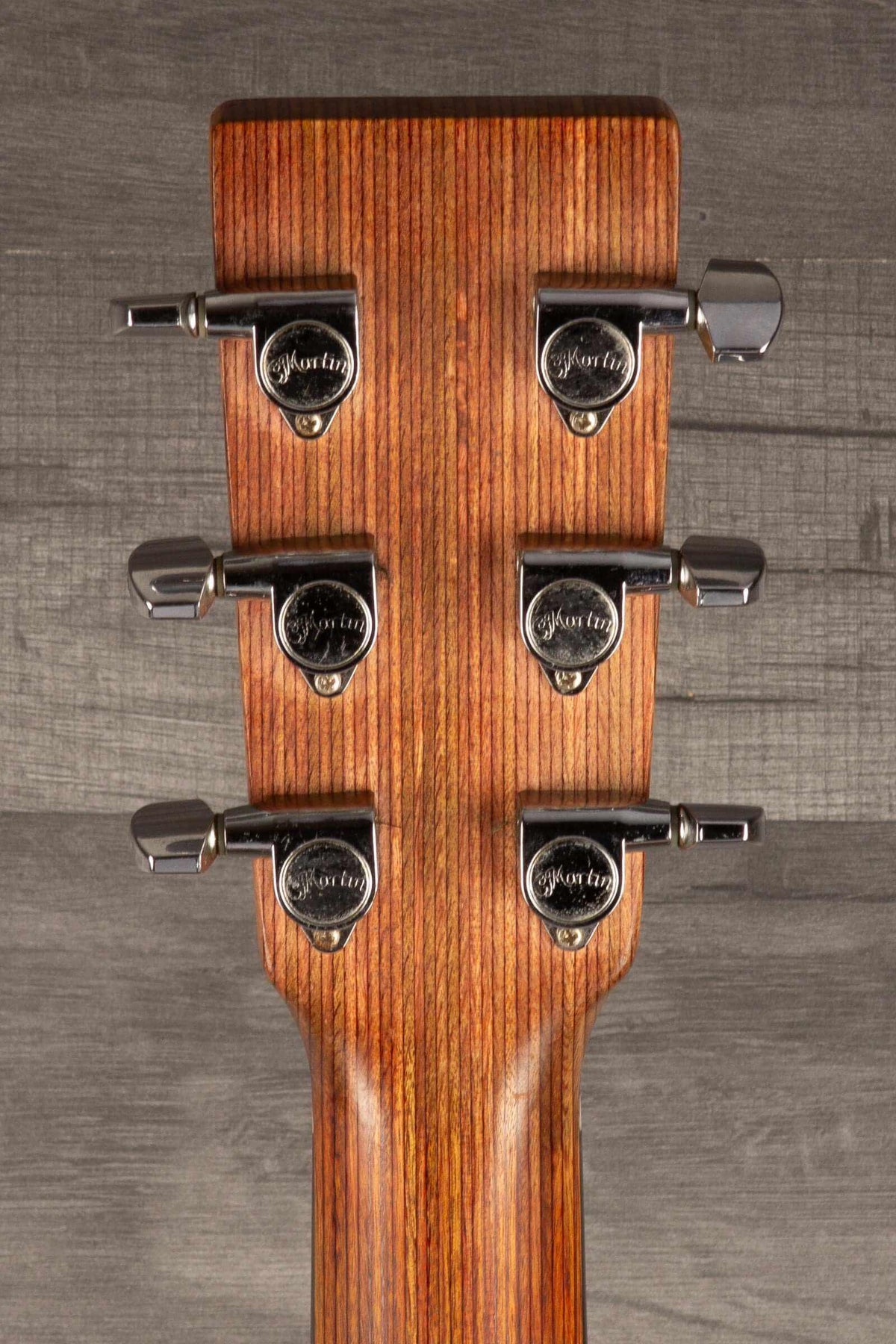 USED - Martin 000X1 inc LR Baggs M1 & hard case headstock with tuning pegs and wood grain detail.