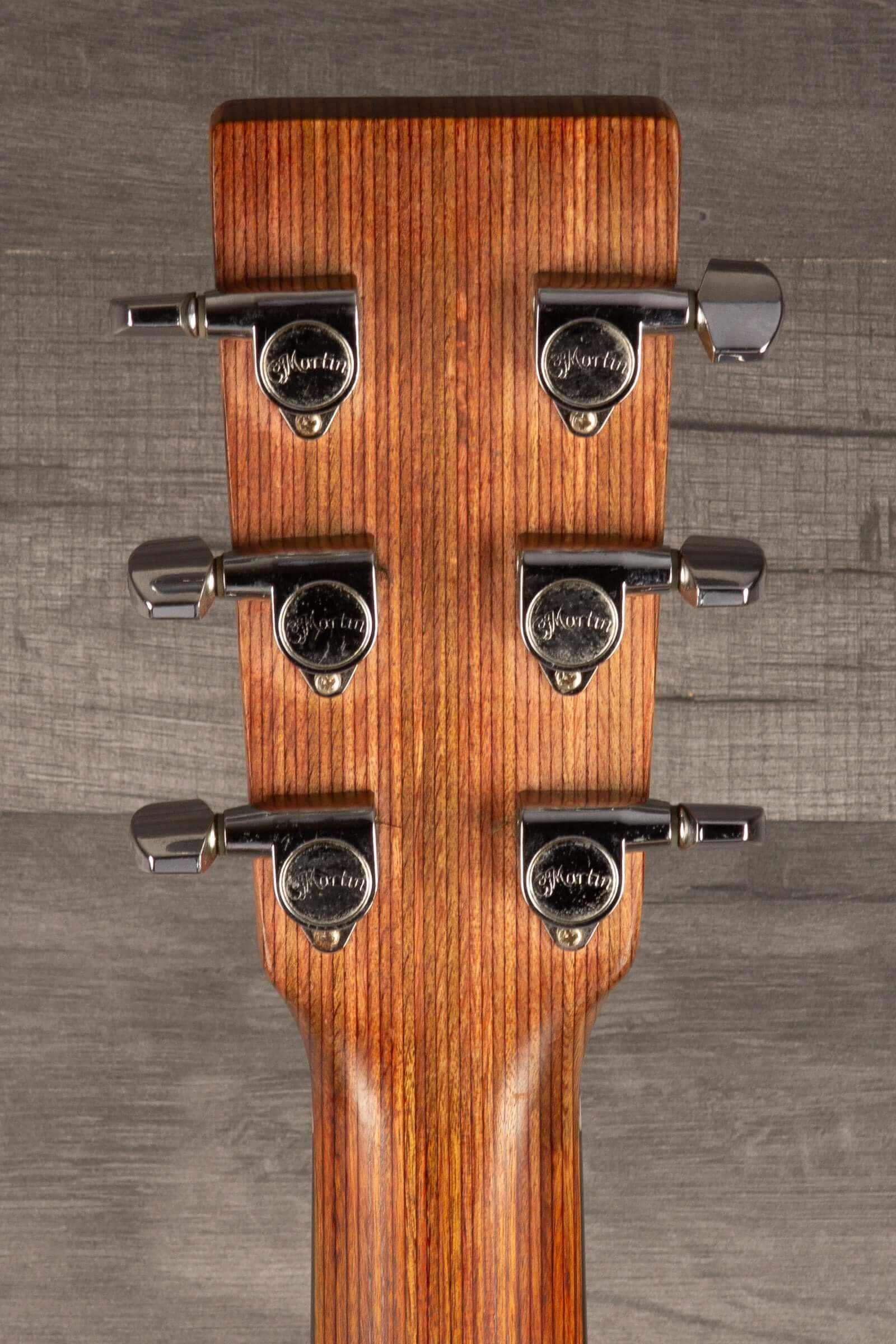 USED - Martin 000X1 inc LR Baggs M1 & hard case headstock with tuning pegs and wood grain detail.