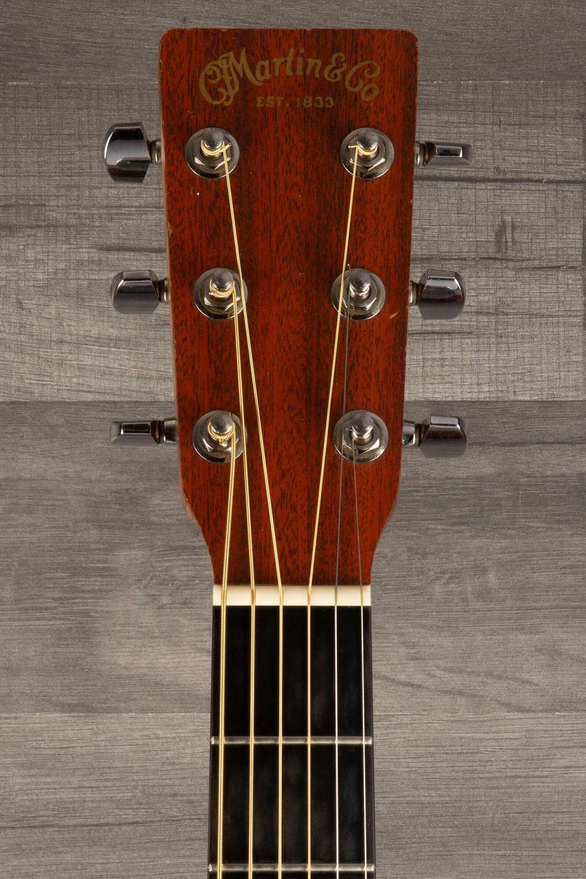 USED - Martin 000X1 inc LR Baggs M1 & hard case headstock view with tuning pegs and strings.