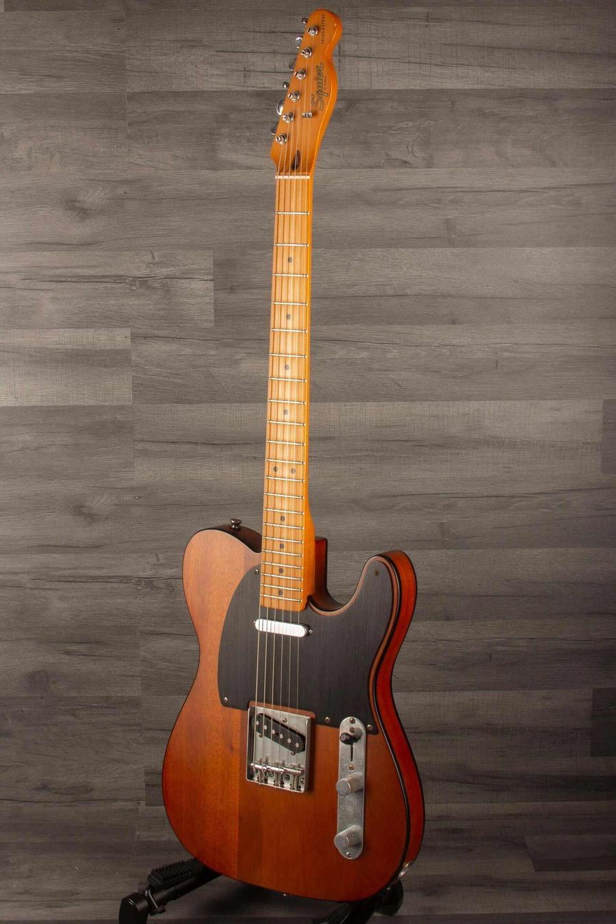 USED - Squier 40th Anniversary Telecaster vintage edition in Satin Mocha, featuring a sleek design and classic aesthetic.