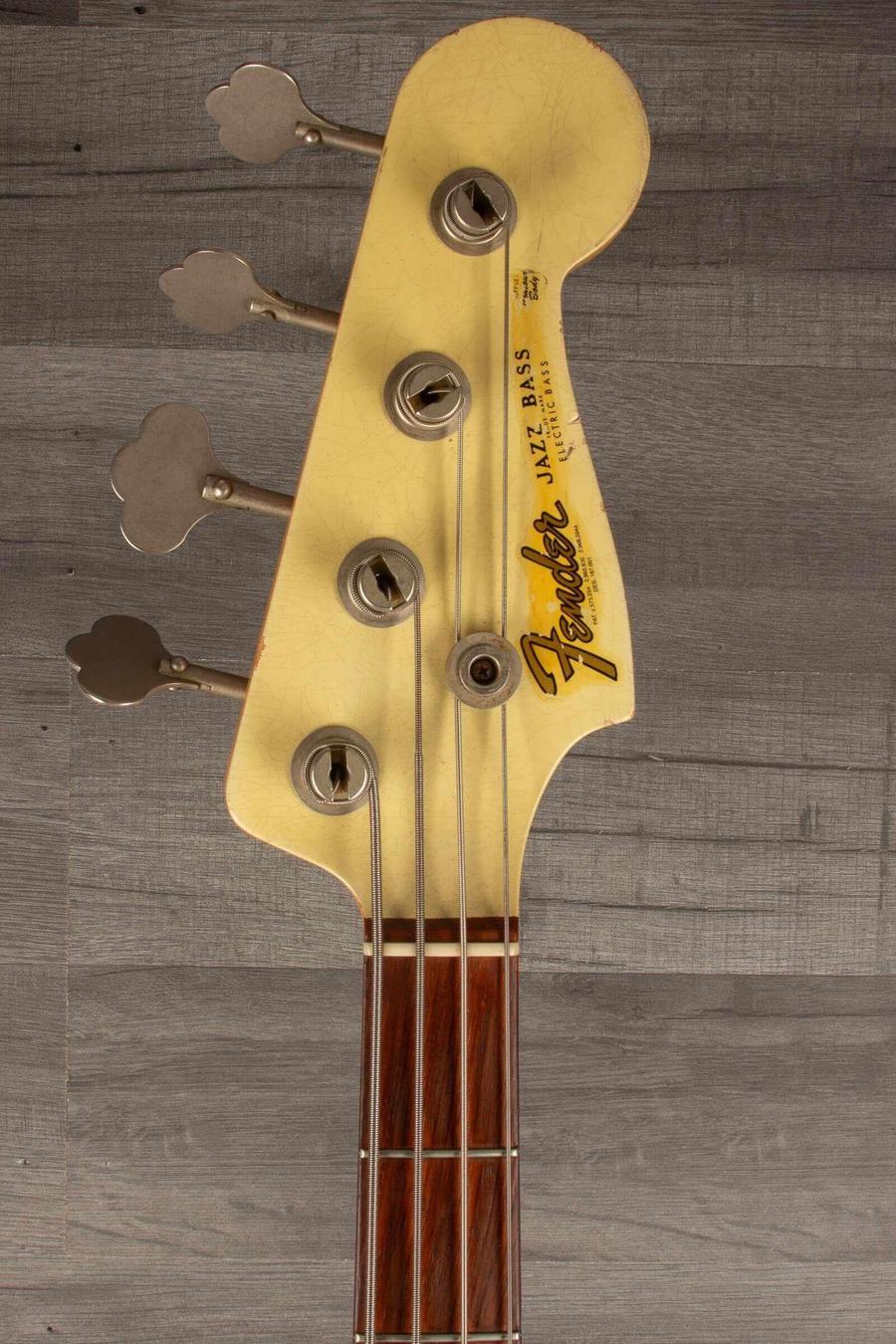 USED Fender Custom shop 64 Jazz Bass headstock with tuning pegs and logo, in good condition.