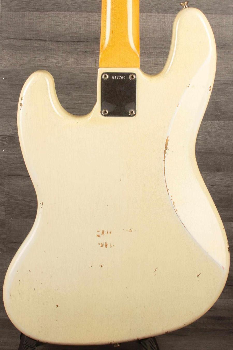 USED Fender Custom shop 64 Jazz Bass back view showing heavy relic finish and wear.