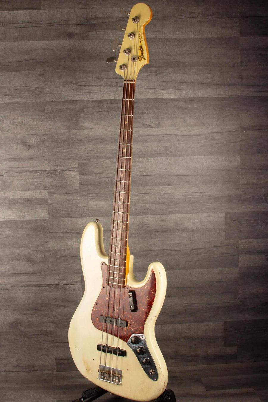 USED Fender Custom shop 64 Jazz Bass in good condition with heavy relic finish and original hard case.