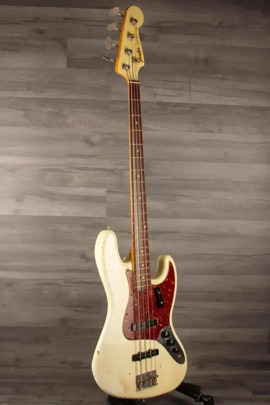USED Fender Custom shop 64 Jazz Bass in good condition with heavy relic finish and original bridge and pickup covers.