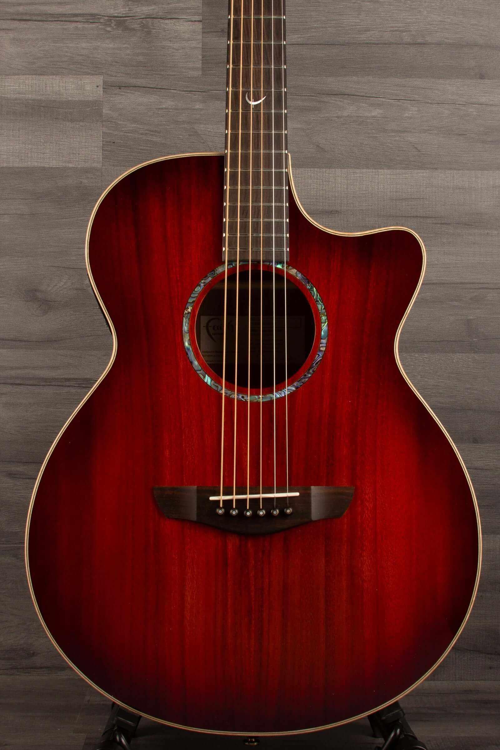 Faith BLOOD MOON Series Venus CE Inc Case - close-up of glossy red guitar with intricate design.