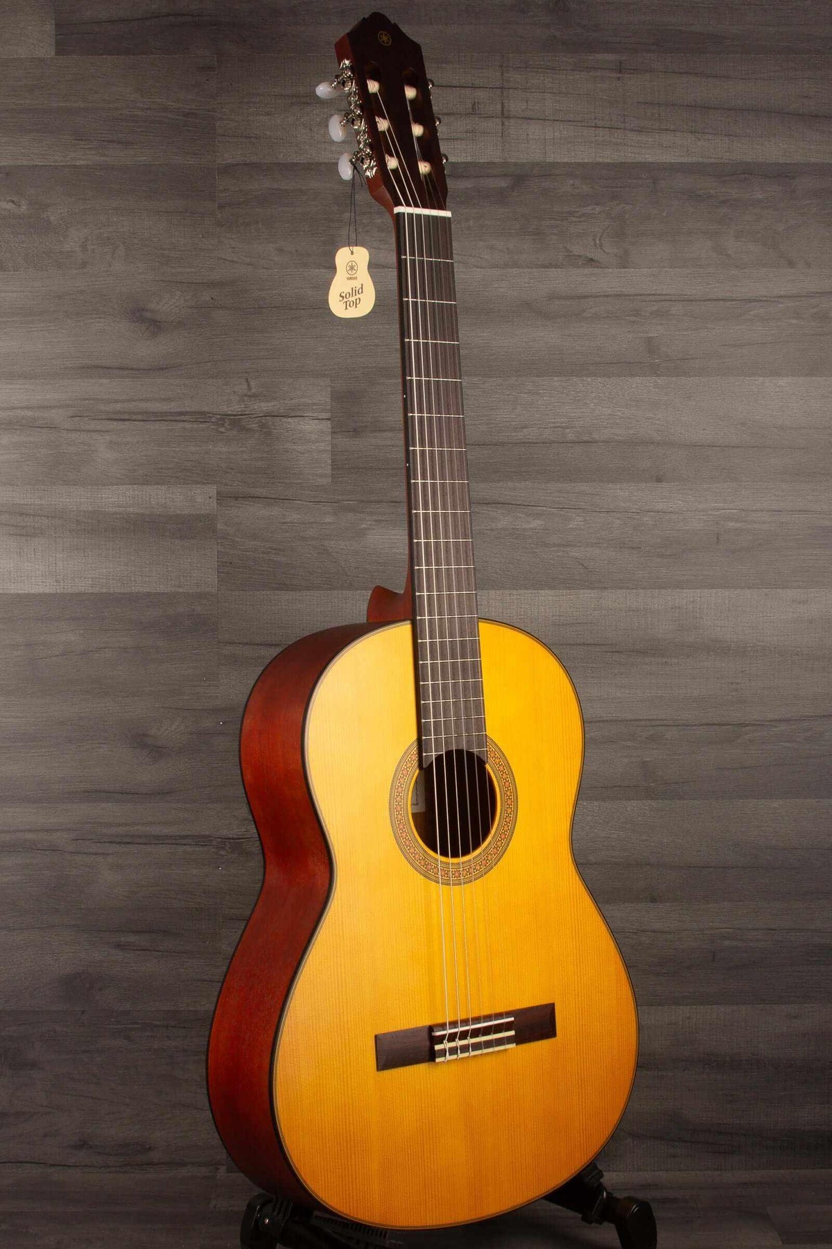 Yamaha CG122MS classical guitar showcasing affordable classical guitar features with bold tone and elegant wood finish.