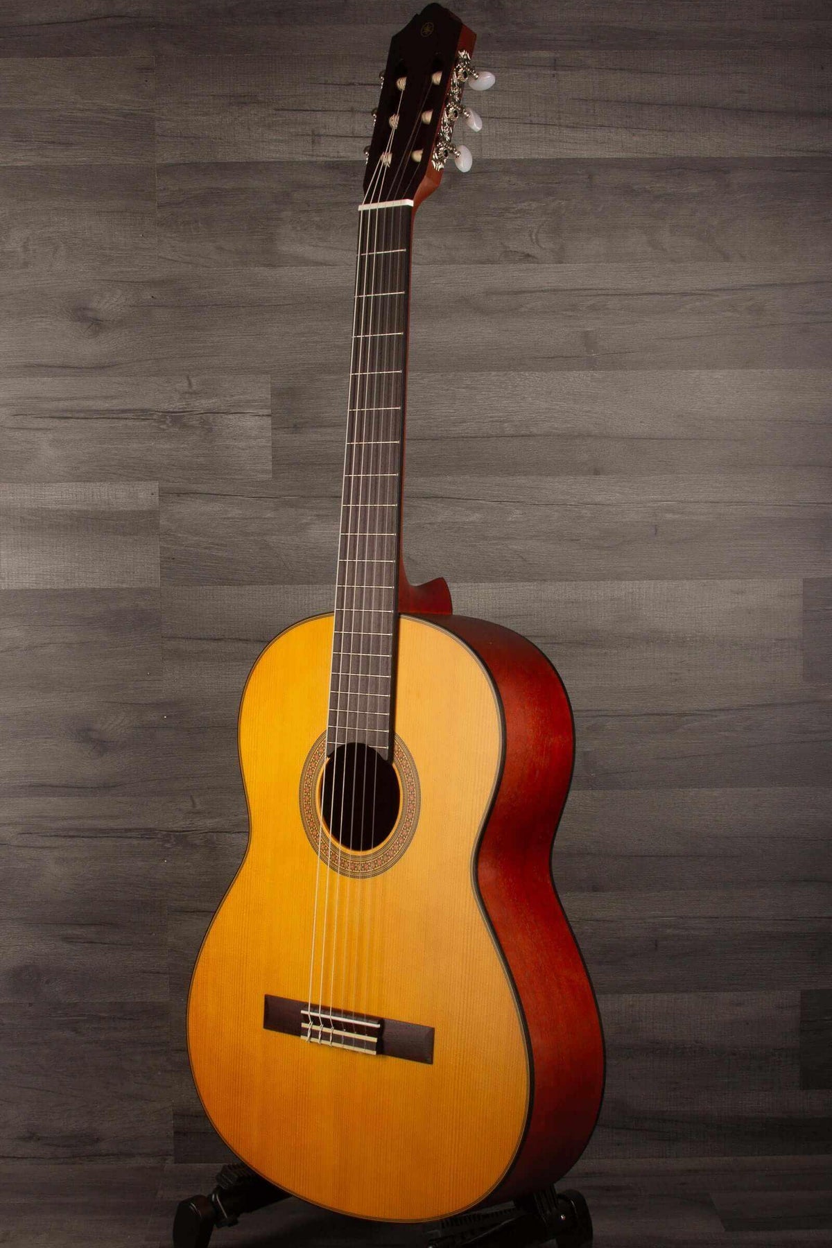 Yamaha CG122MS classical guitar featuring beautiful wood finish, an affordable classical guitar with great projection.