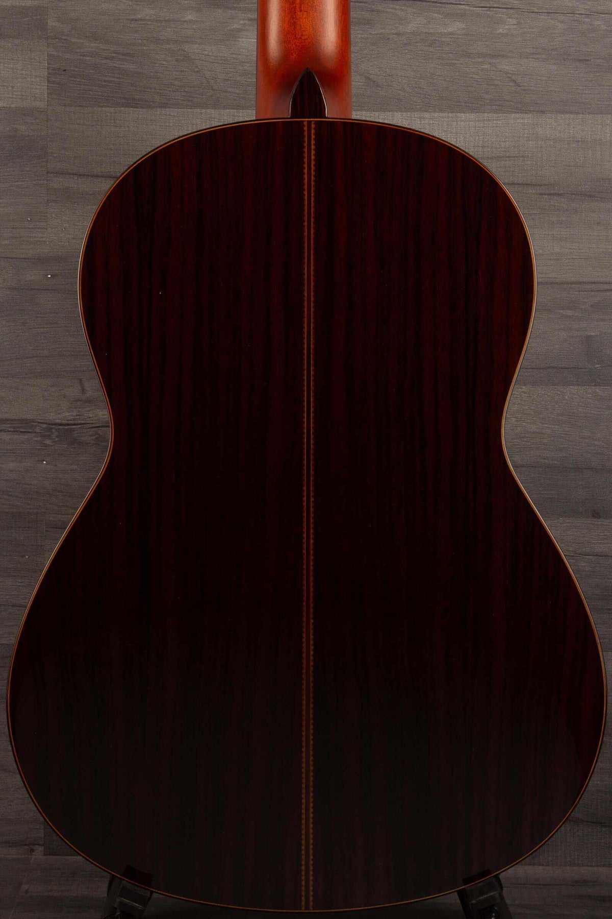 Back view of Yamaha CG192C classical guitar showcasing its rich wood finish and craftsmanship.