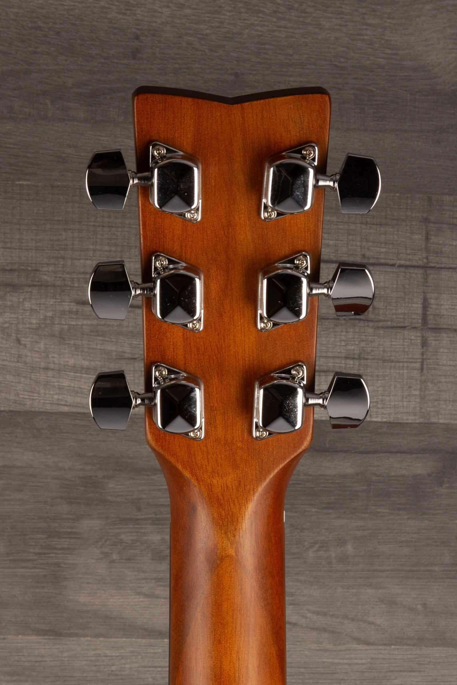 Yamaha F400 Natural Satin guitar headstock showcasing tuning pegs and natural wood finish.