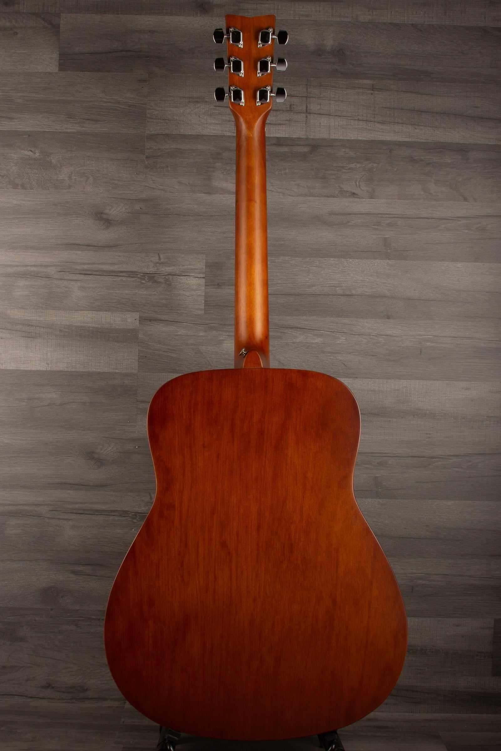 Back view of Yamaha F400 Natural Satin acoustic guitar showcasing its smooth wood finish and classic shape.