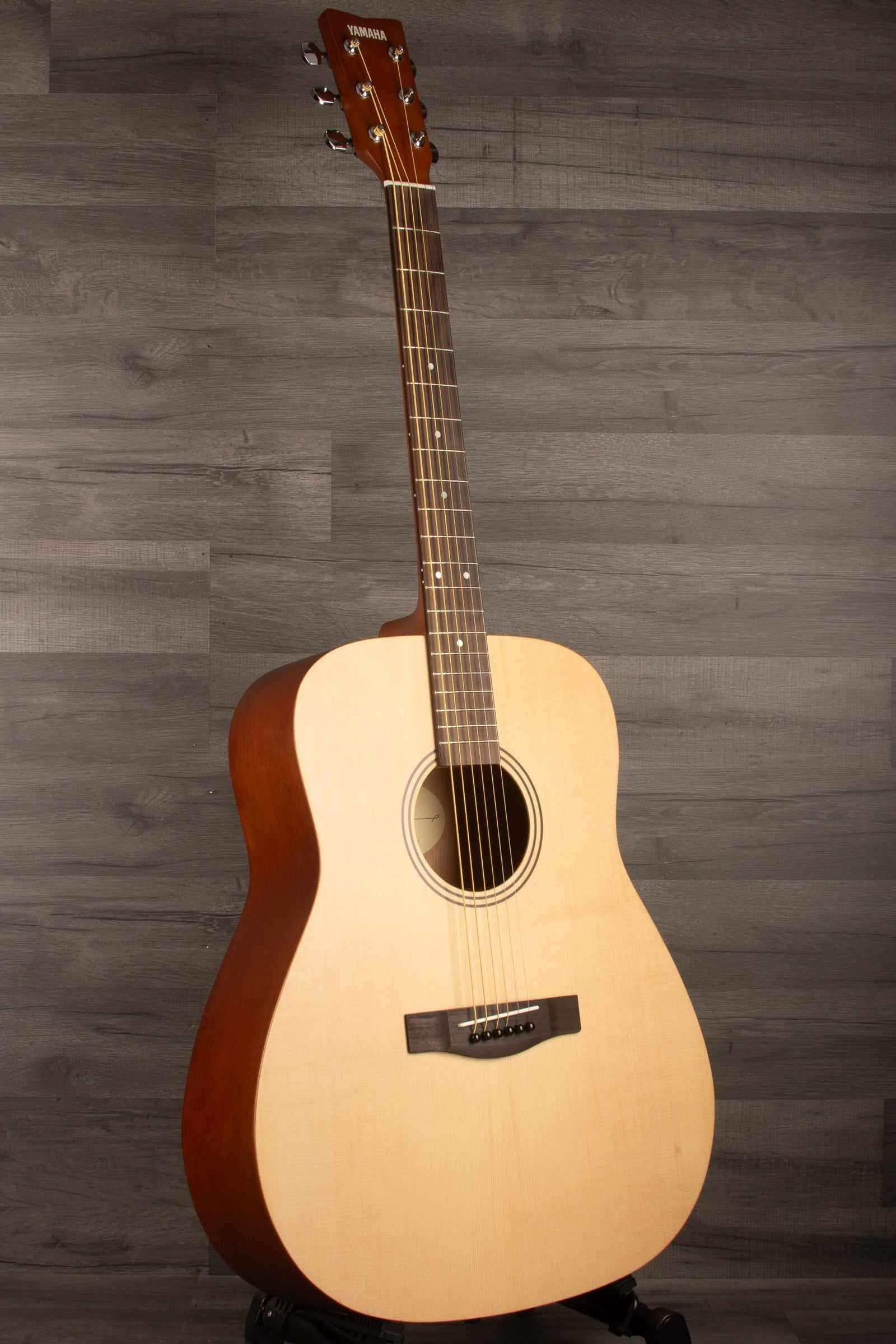 Yamaha F400 Natural Satin acoustic guitar showcasing its natural satin finish and classic dreadnought design.