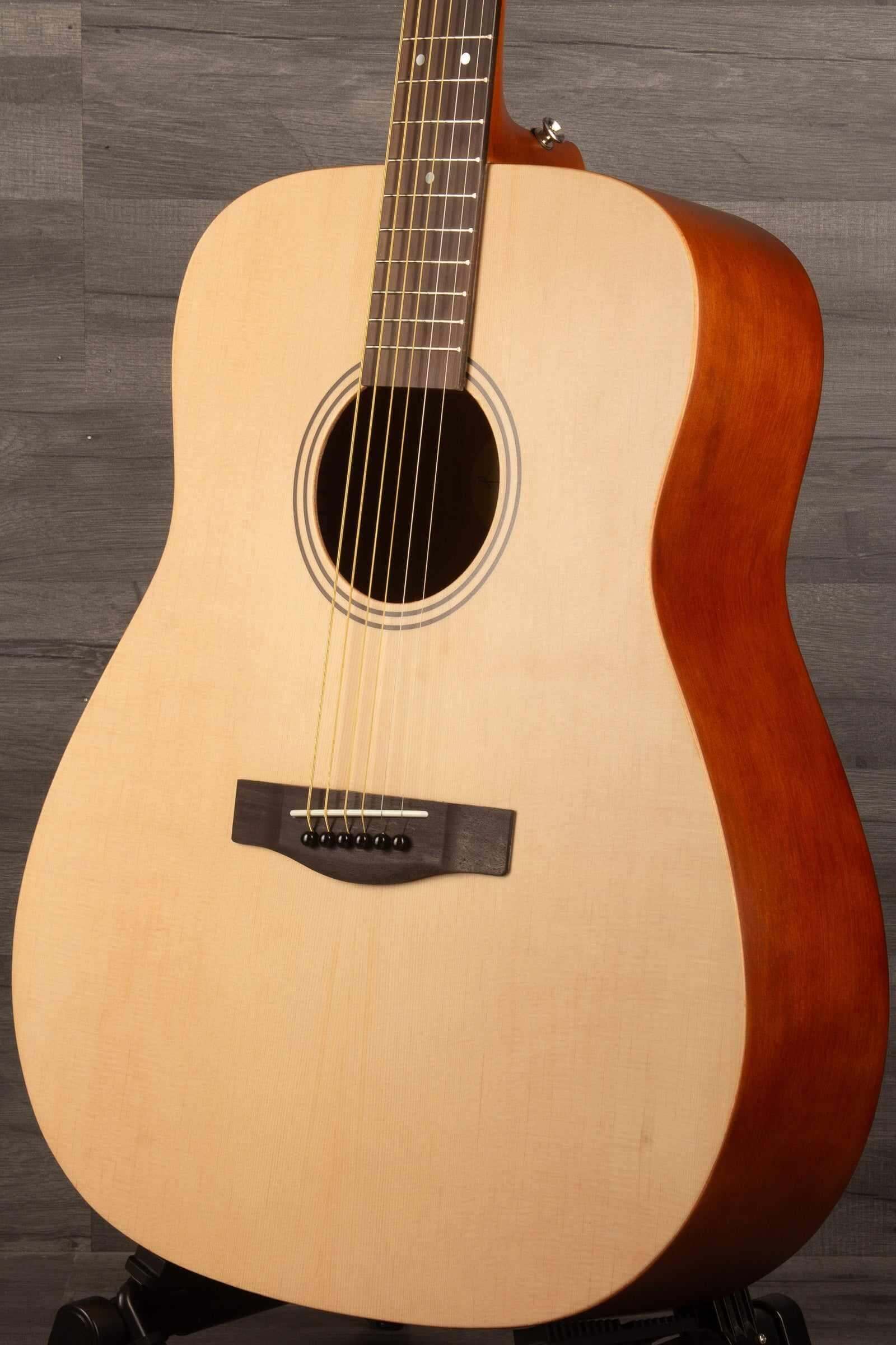 Yamaha F400 Natural Satin acoustic guitar showing natural wood finish and dreadnought body design.