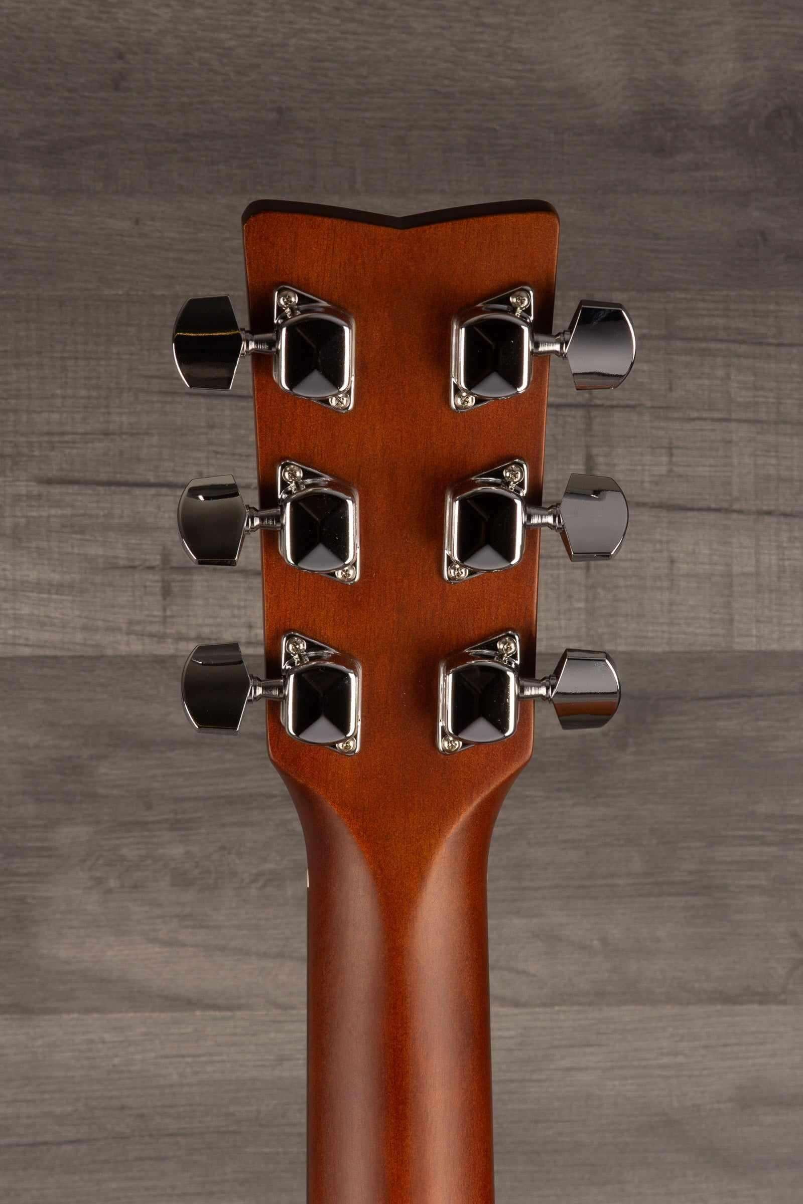 Yamaha FS400 Natural Satin guitar headstock showcasing tuning pegs and sleek design.