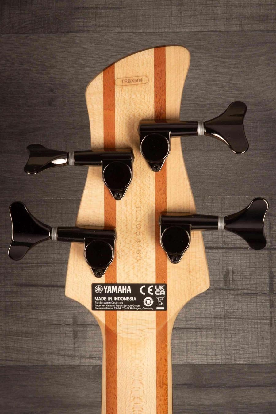 Yamaha TRBX504 Brick Burst Bass Guitar headstock with tuning pegs and logo details.