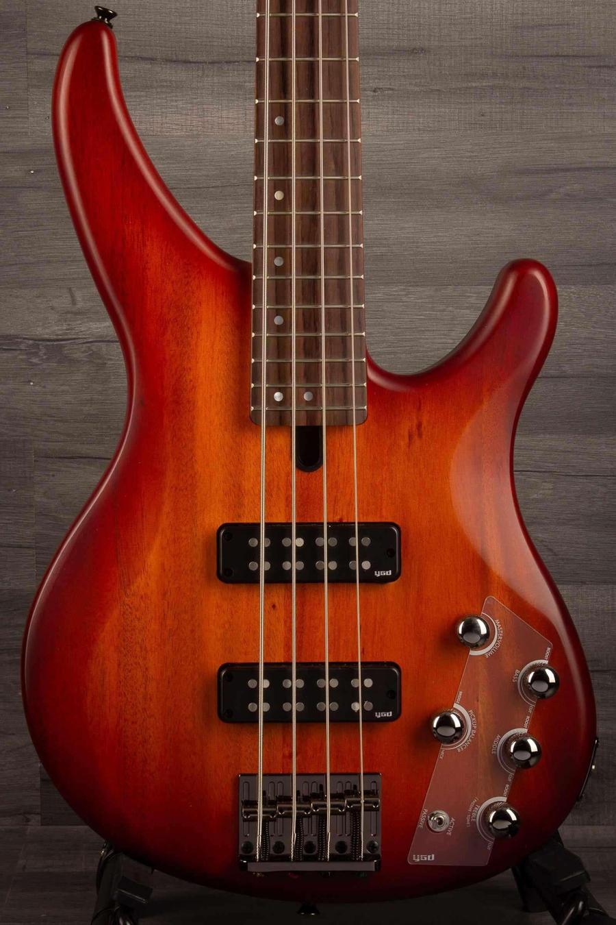 Yamaha TRBX504 Brick Burst Bass Guitar showcasing its dynamic tone and Translucent Brown finish.