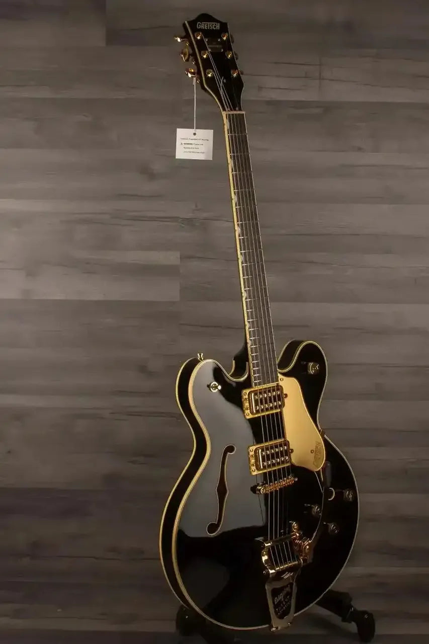 Gretsch Broadkaster® LX Center Block guitar in black with gold hardware and ebony fingerboard, showcasing modern design and features.