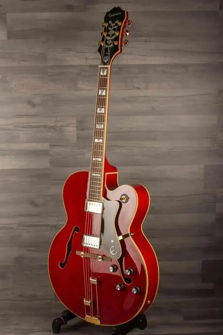 Epiphone Broadway Electric Guitar - Wine Red, Includes Premium Gig Bag displayed on a stand