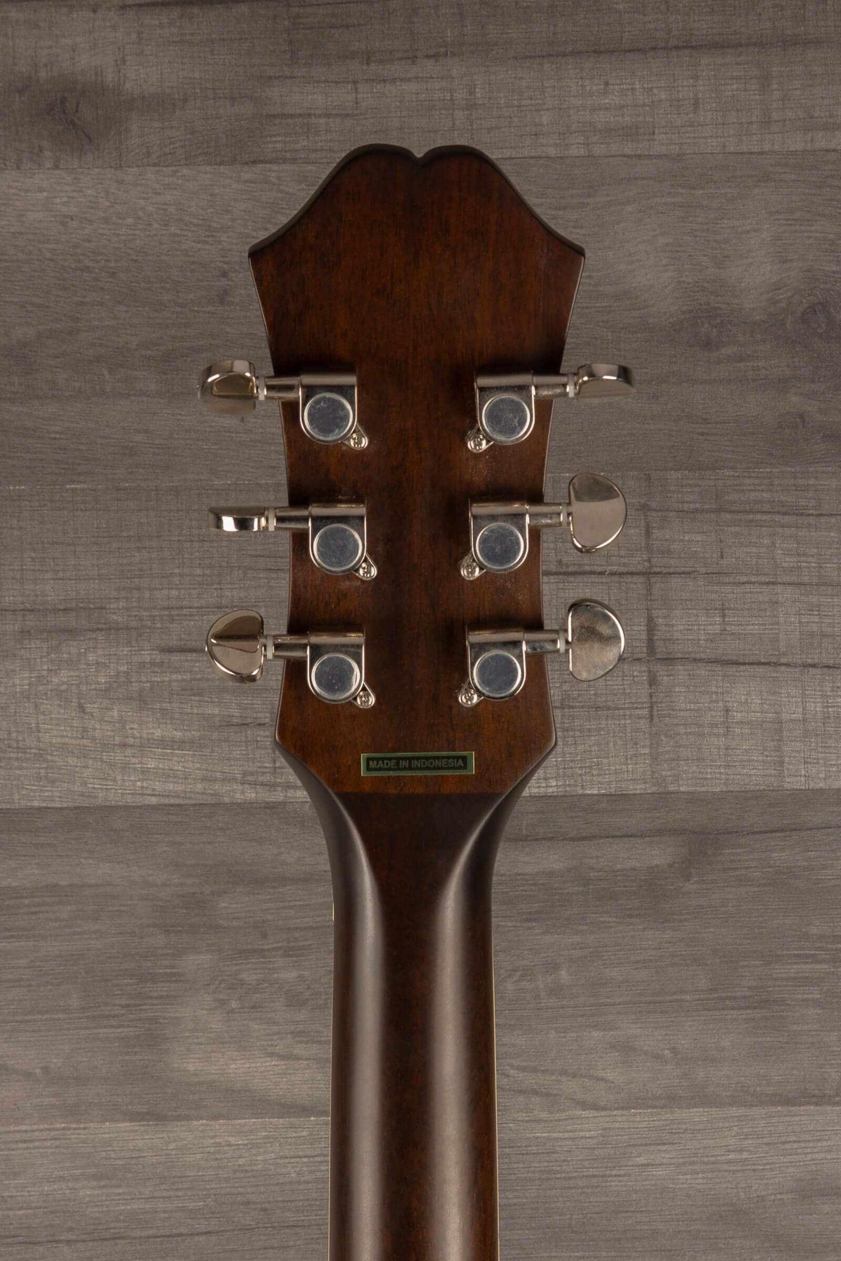 Epiphone J45 Studio Solid Top - Natural, Acoustic Guitar headstock with tuning pegs on a wooden background.