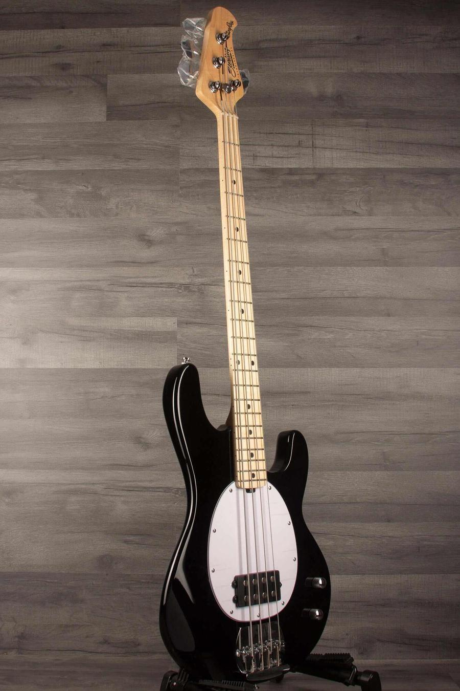 Sterling Stingray Intro series RAY2 Bass Guitar - Black displayed on a stand with poplar body and maple neck.
