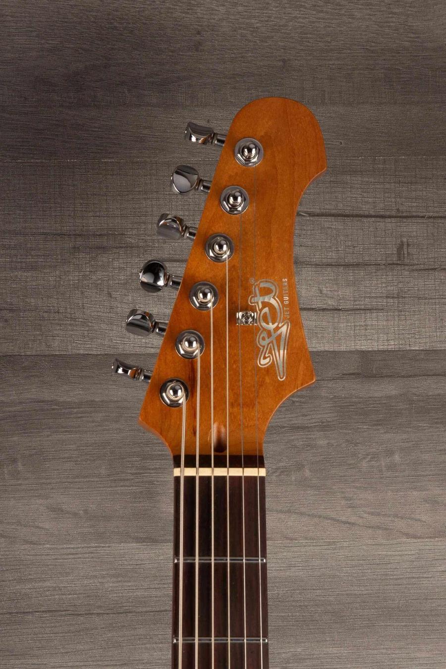Close-up view of the headstock of the USED - Jet JJ350 Baritone Guitar - Moonburst showing tuning pegs and logo.