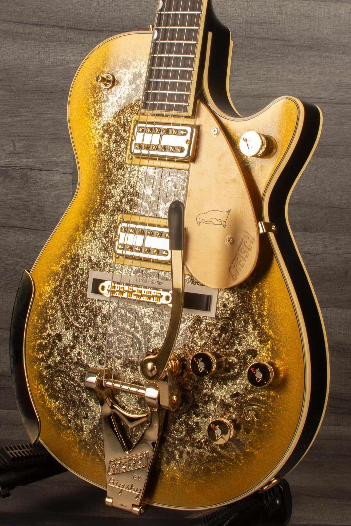 Limited Edition Paisley Penguin™ guitar with Bigsby®, gold paisley finish, and ebony fingerboard.