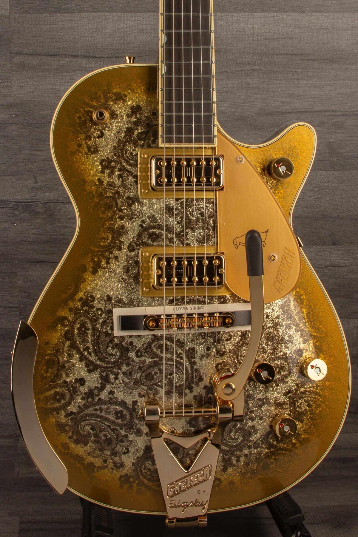 G6134TG Limited Edition Paisley Penguin™ guitar with ebony fingerboard and Bigsby in gold paisley finish.