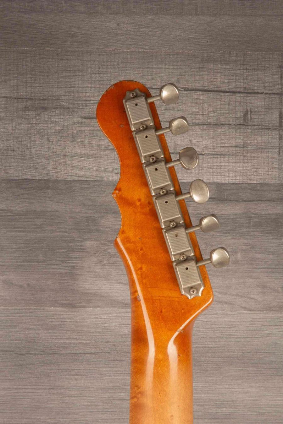 Headstock of the Regent 7 - Duophonic All Gold guitar featuring vintage nickel hardware.