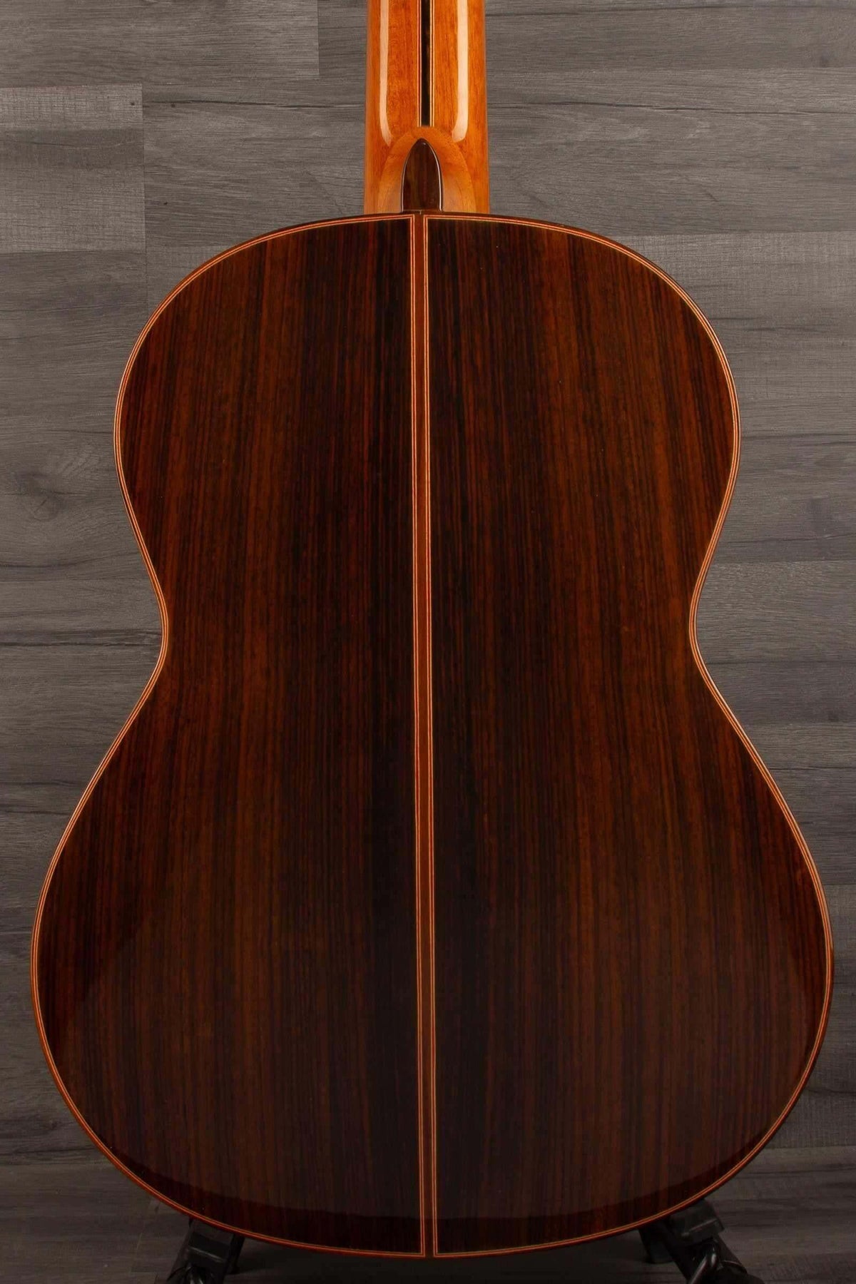 USED - Manuel Rodriguez model E guitar back view showcasing its rich wood grain and craftsmanship.