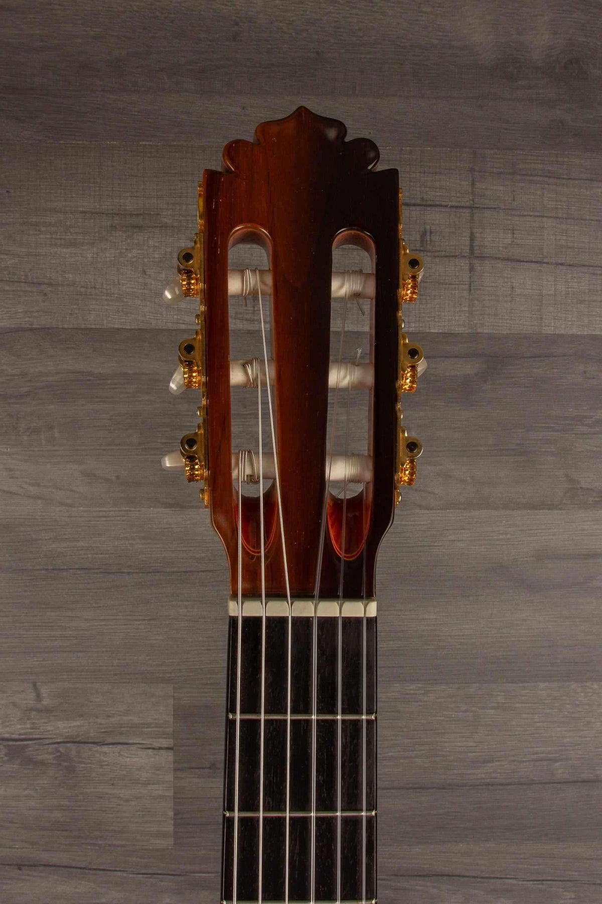 USED - Manuel Rodriguez model E guitar headstock view showcasing unique design and quality materials.