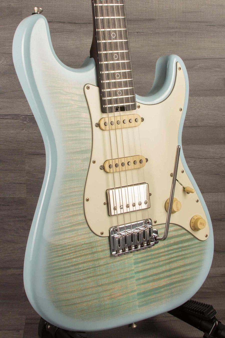 Schecter Nick Johnston Trad Flame Top Wembley Nitro USA in Atomic Ice finish with flamed maple top and silver rings.
