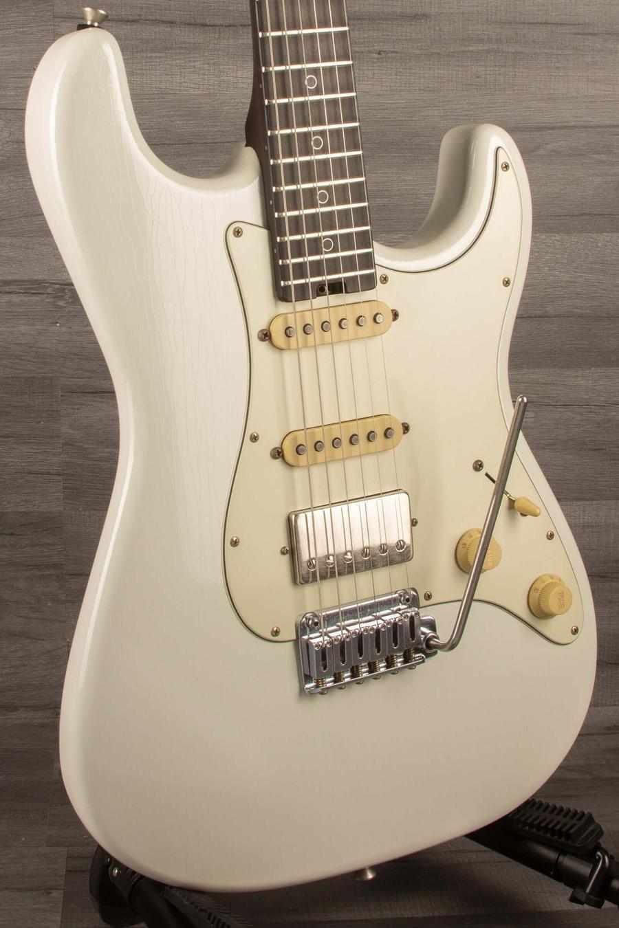 Schecter USA Nick Johnson trad Wembley in Atomic Snow finish, featuring a nitro finish and HSS pickup configuration.