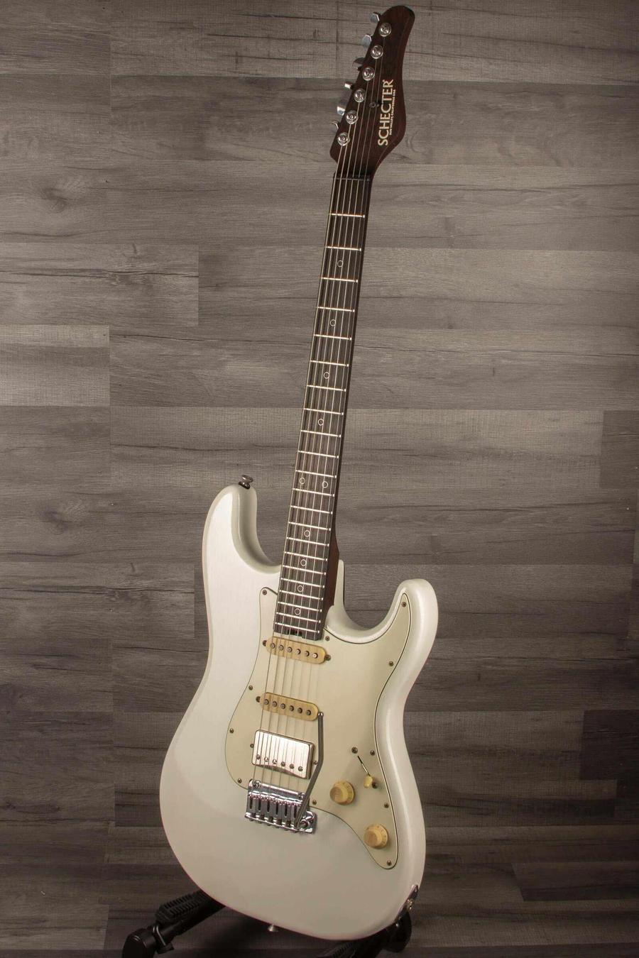 Schecter USA Nick Johnson Trad Wembley guitar in Atomic Snow finish, showcasing vintage styling and smooth playability.