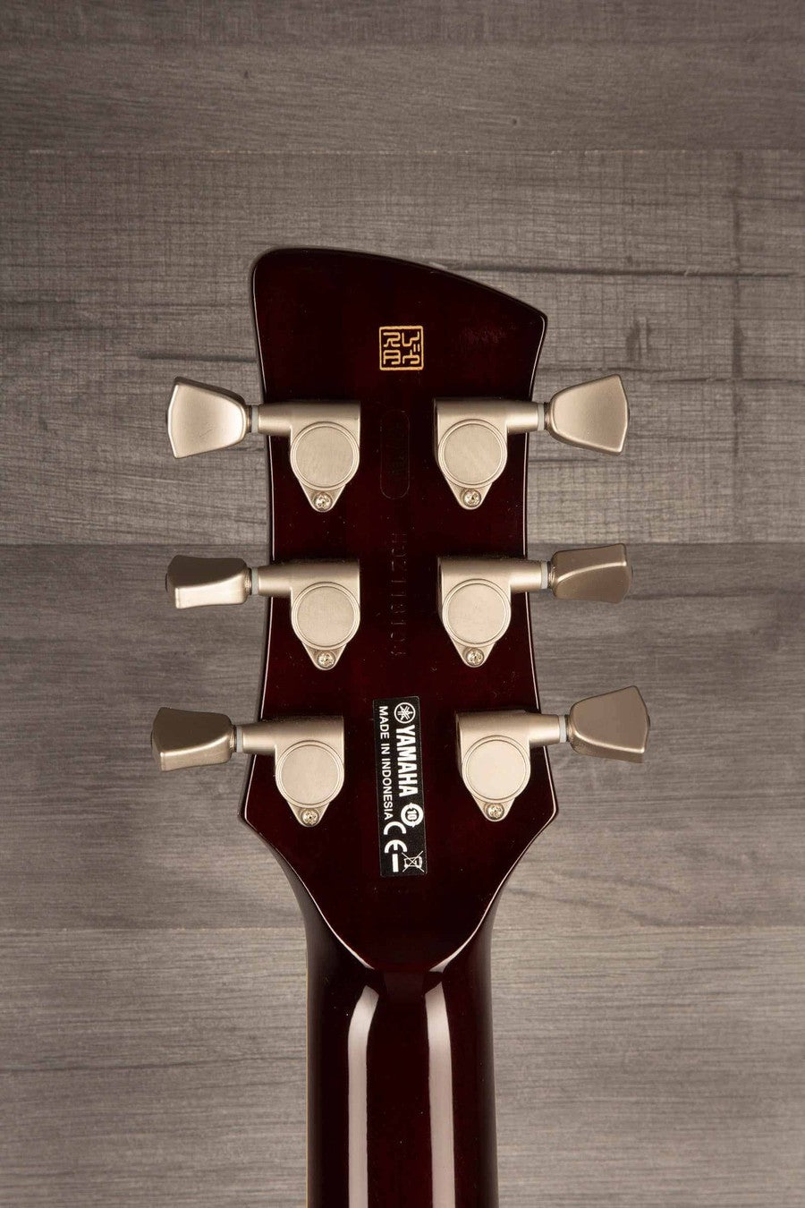 Yamaha RS502T FMX guitar headstock featuring tuning pegs and logo, showcasing its quality craftsmanship.