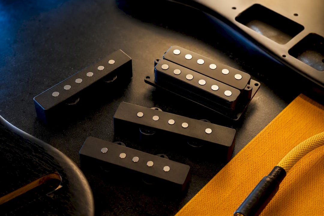Close-up of contrasting bass pickup designs