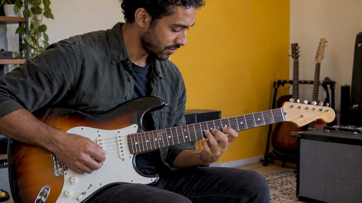 Guitarist playing a scale on electric guitar