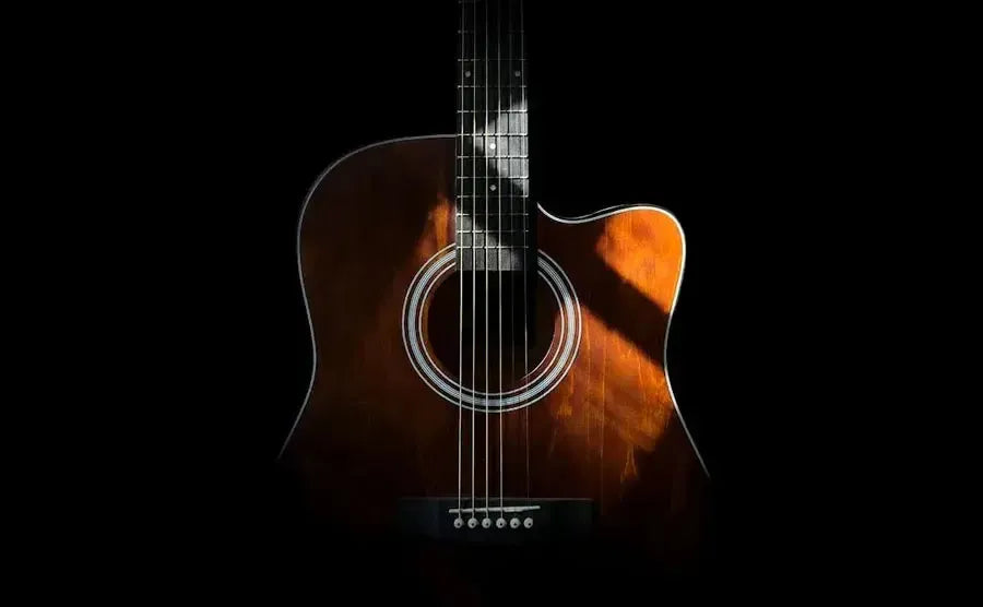 Close-up of acoustic guitar strings on wooden guitar
