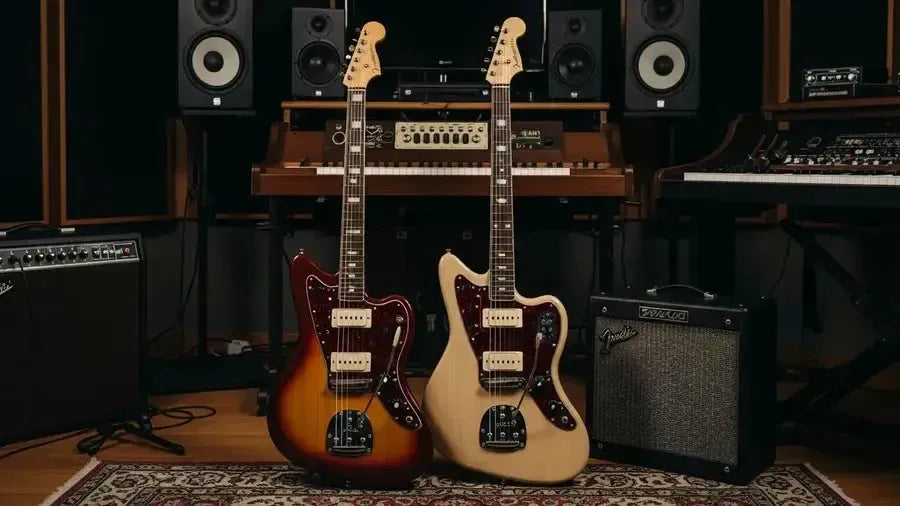 Fender Jazzmaster and Jaguar guitars in a music studio, showcasing their unique offset designs and finishes