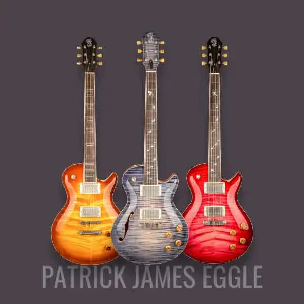 Three electric guitars by Patrick James Eggle in vibrant colors: orange, blue, and red, displayed against a grey background.
