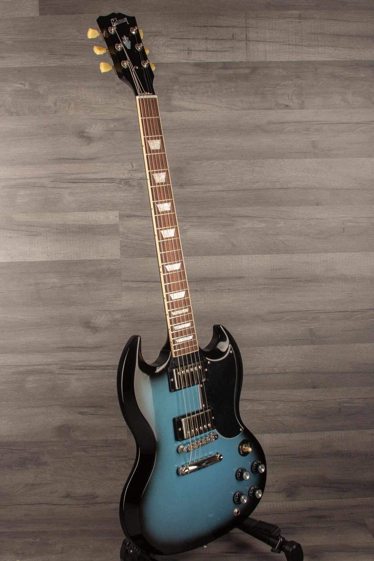 Gibson SG Standard '61 Stopbar Electric Guitar - Pelham Blue Burst showcased on a gray wooden background.