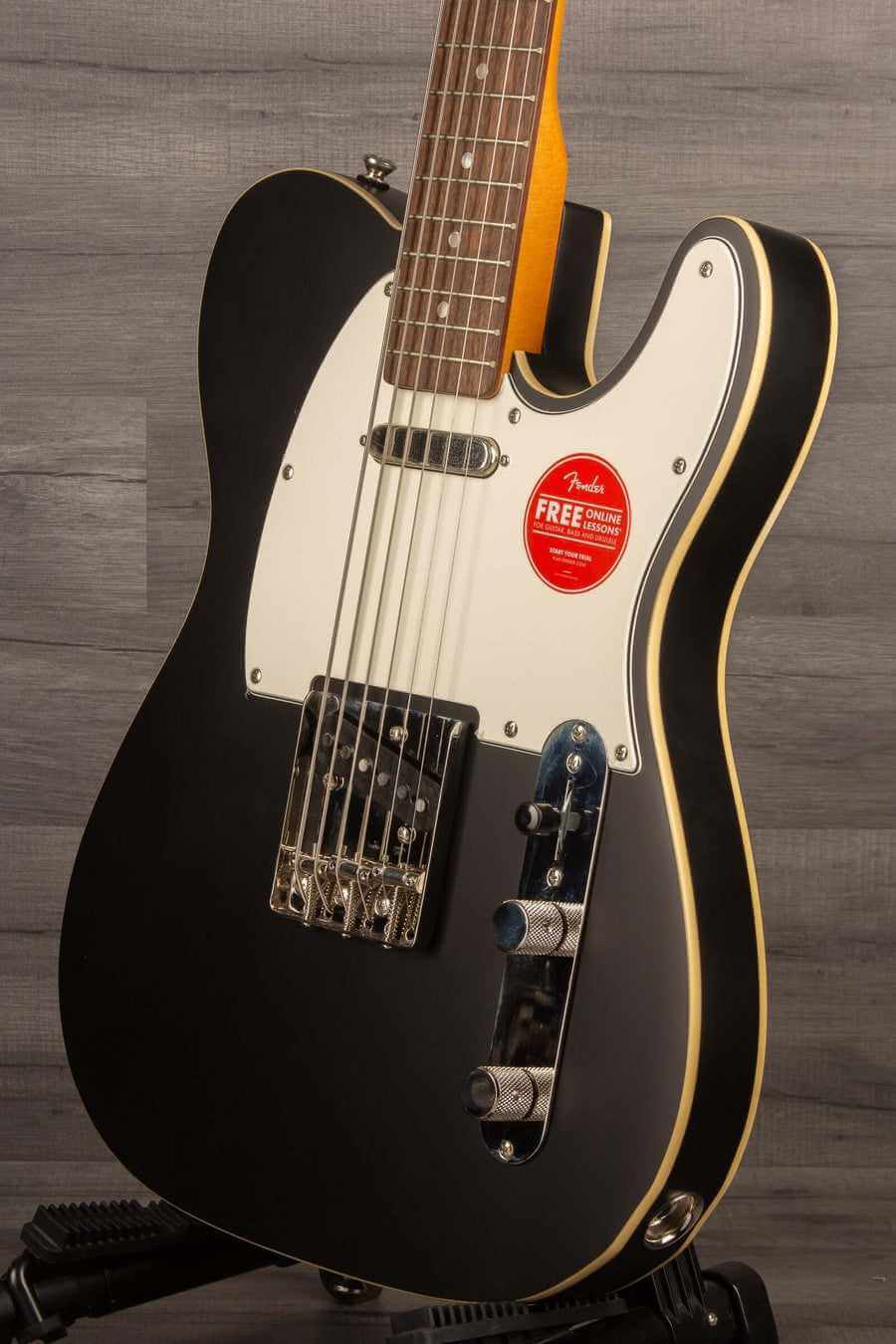 Squier Classic Vibe Baritone Custom Telecaster in Satin Black with Laurel Fingerboard and Parchment Pickguard.
