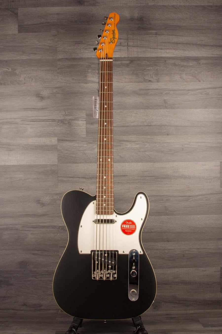 Squier Classic Vibe Baritone Custom Telecaster with Laurel fingerboard and Parchment pickguard in Satin Black finish.