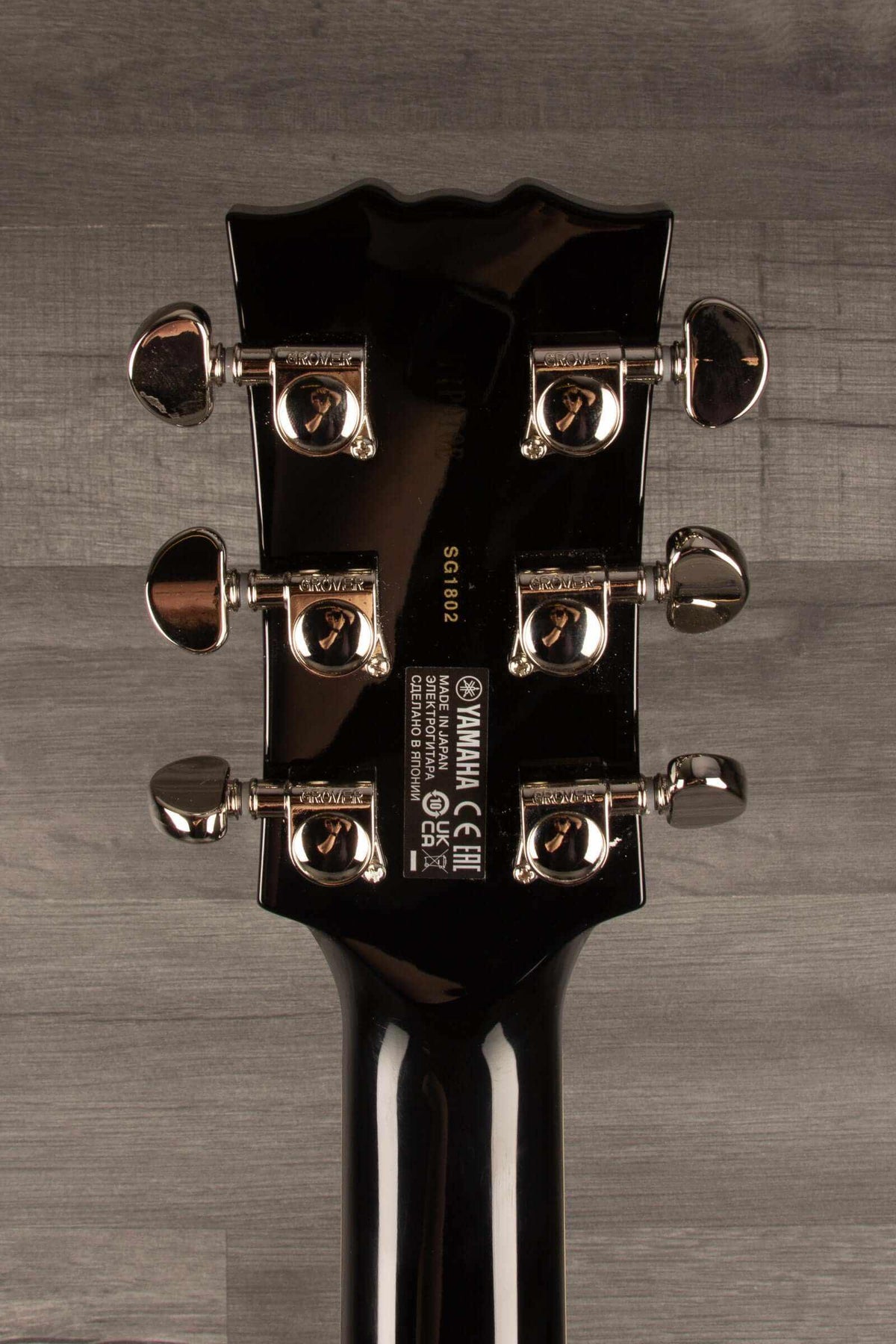 B-stock Yamaha SG1802 Black - Premium Electric Guitar headstock with chrome tuners and detailed branding.