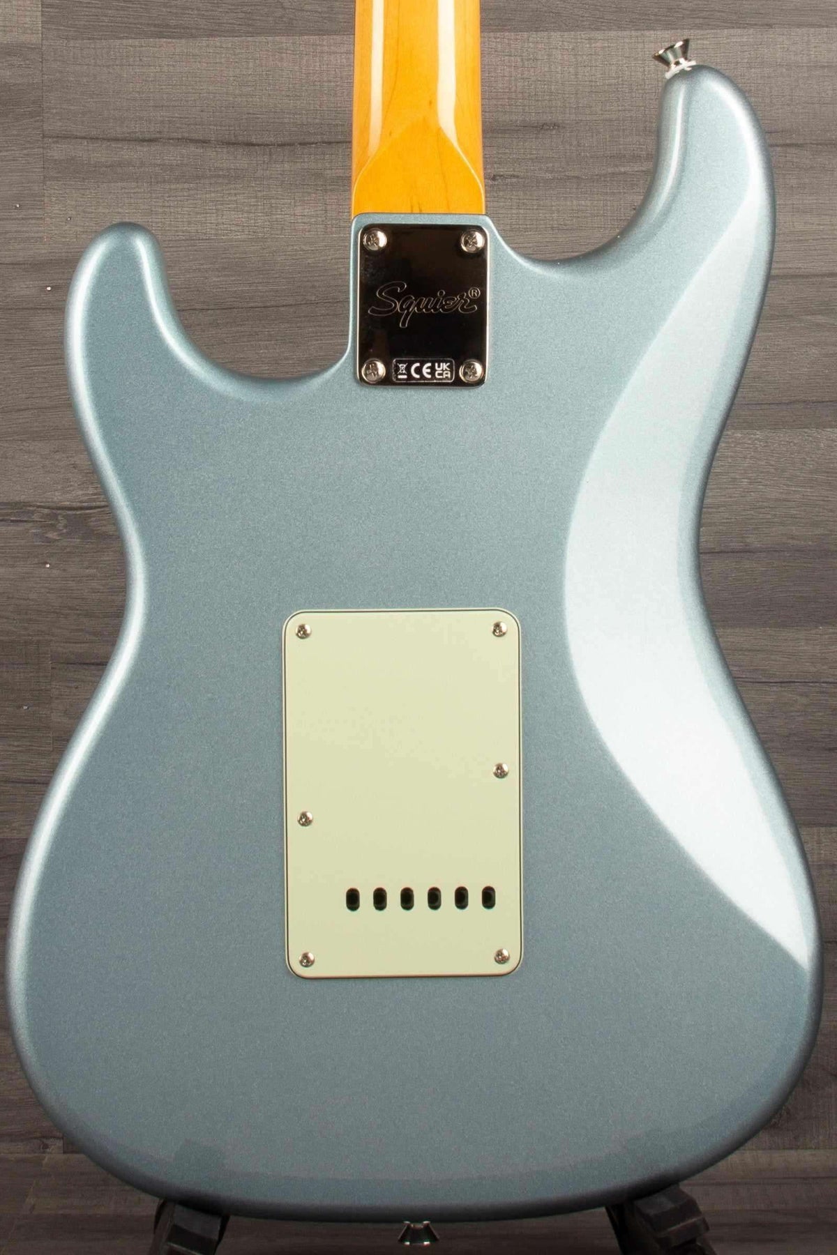 Back view of Squier FSR Classic Vibe 60s Stratocaster HSS in Ice Blue Metallic with mint pickguard.