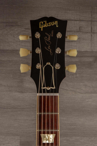 Gibson Les Paul guitar headstock with classic logo, tuners, and rosewood fingerboard.