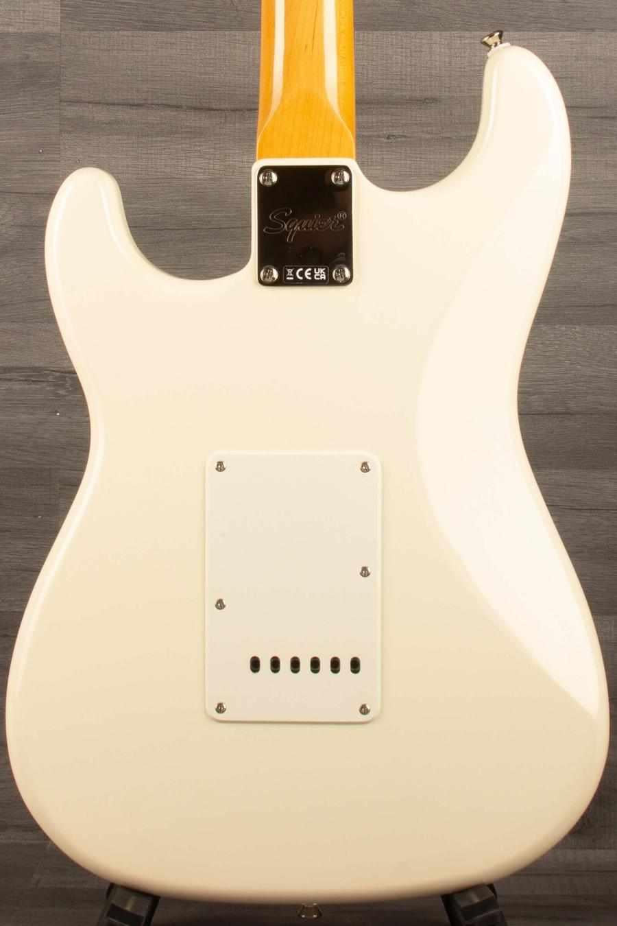 Back view of Squier FSR Classic Vibe '60s Stratocaster in Olympic white showcasing its sleek design and construction.